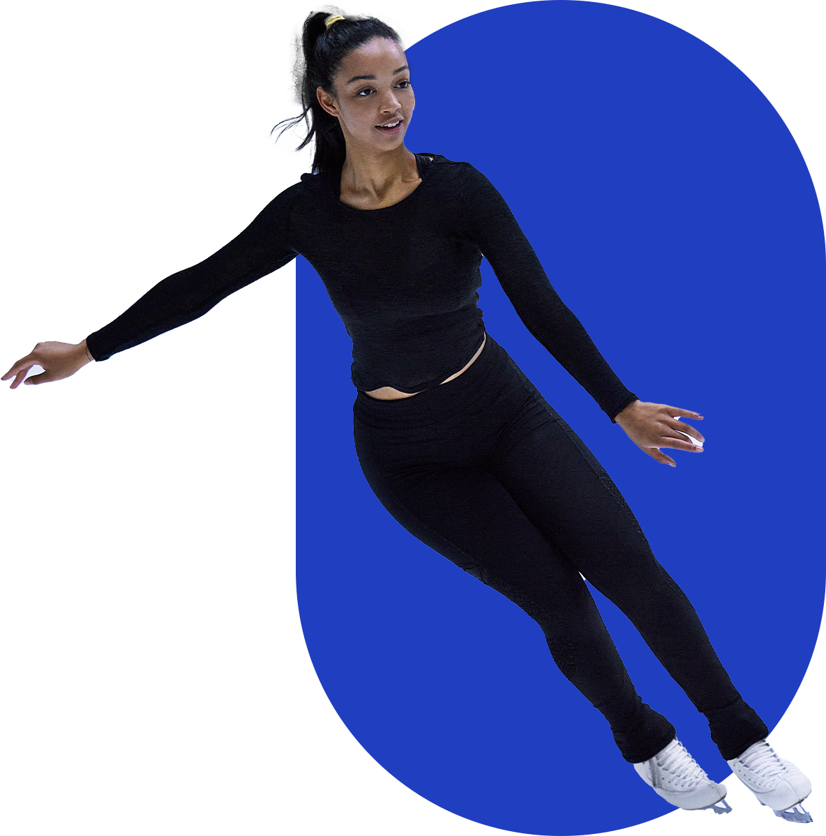 Person in black outfit ice skating against a blue background.